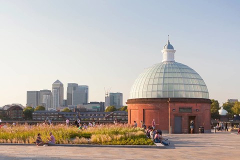 Greenwich foot tunnel entrance with Canary Wharf in the distance