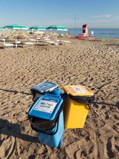 Recycling bins on a beach in Riccione