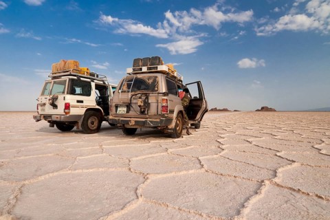 SUVs parked on the salt formations of the Ass Ale salt lake in the Danakil Depression