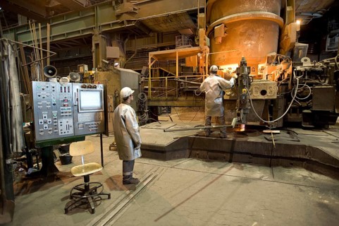 Liquid steel pouring from the ladle into the casting