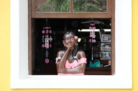 Female figure at a window of a souvenir shop