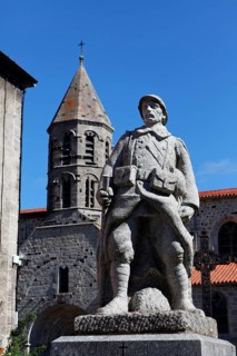 War memorial and church in the village of Saugues