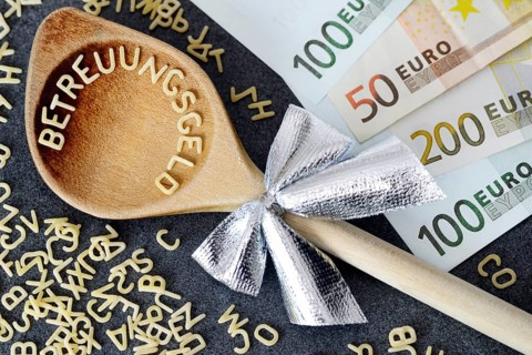 Wooden spoon with the word Betreuungsgeld
