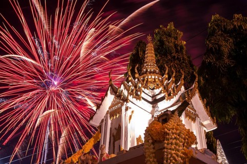 Fireworks behind a Buddhist temple