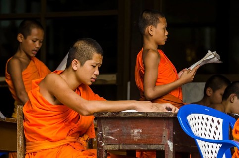 Buddhist monks being taught in a monastery school