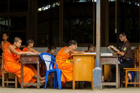 Buddhist monks being taught in a monastery school