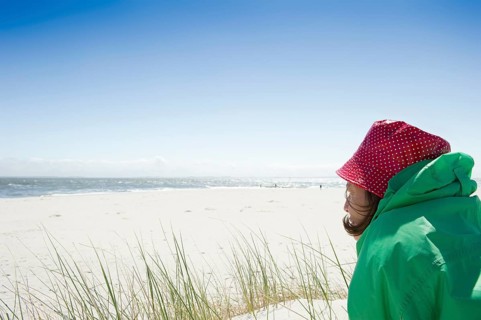 A woman sitting on the beach