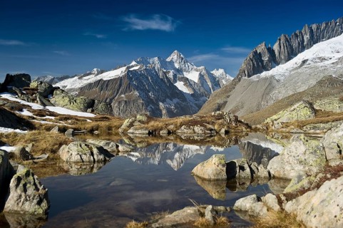 Small lake above the Aletsch Glacier and the Bernese Oberland