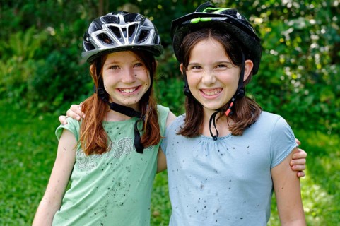 Girls wearing cycle helmets