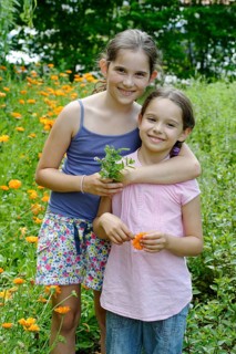 Girls in a meadow of marigolds
