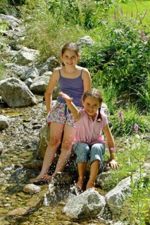 Girls playing and splashing with water