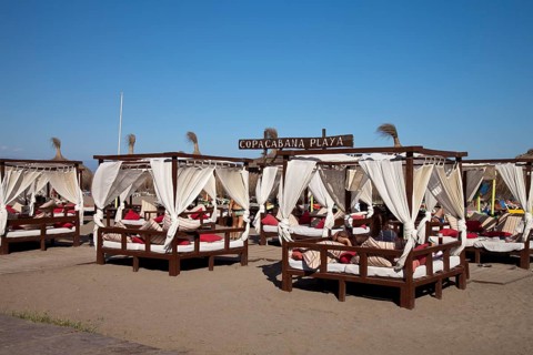 Sunbeds on the Copacabana Playa beach