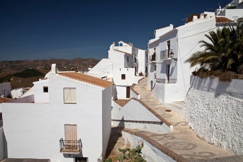 White houses in a narrow alley in Frigiliana