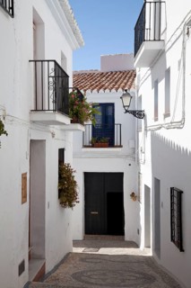 White houses in a narrow alley in Frigiliana