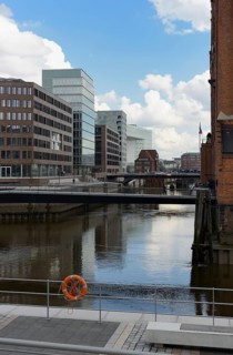 Modern office buildings at Brooktorhafen harbour with Museumsbruecke bridge