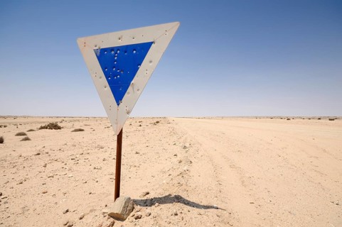 Weathered road sign