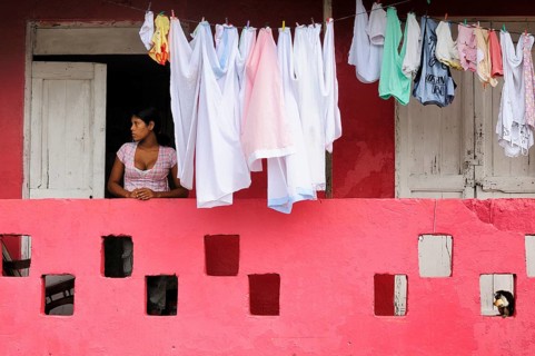 Woman next to washing on the line