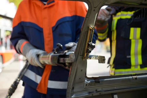 Firefighter working with hydraulic rescue equipment