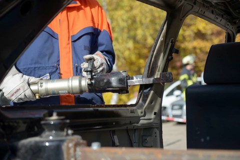 Firefighter working with hydraulic rescue equipment