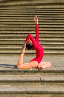 Young woman practising Hatha-Yoga outdoors
