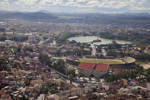 View of city with sports stadium and lake
