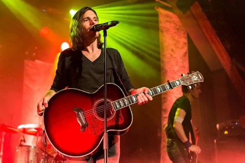 Lead singer and frontman Adrian Sieber from the Swiss pop band Lovebugs performing live in the Schueuer concert hall