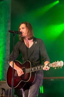 Lead singer and frontman Adrian Sieber from the Swiss pop band Lovebugs performing live in the Schueuer concert hall