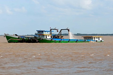 Suction dredger operating on the Mekong River