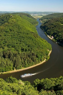 Excursion boat cruising on one arm of the big loop of the Saar river near Mettlach