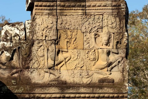 Bas-relief carved in stone depicting two dancing apsaras