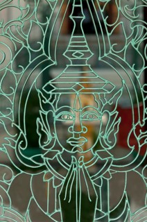 Metal mesh gate with a representation of Buddha in the Royal Palace