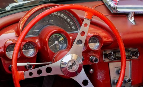 Red steering wheel with dashboard