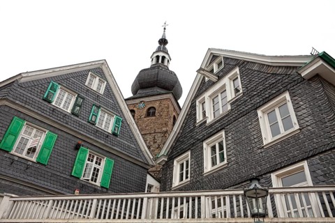 Protestant parish church with houses with slate fronts in the historic town centre of Lennep