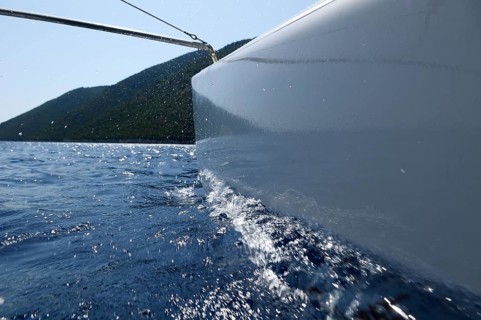 The hull of a catamaran floating on the water