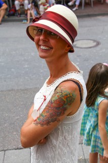 Smiling woman wearing a Panama hat and a summer dress