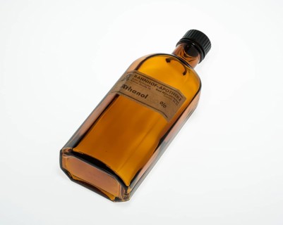 Lying empty brown bottle