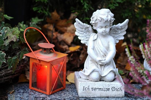 Angel sculpture and a grave lantern