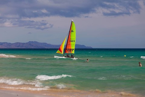 Colorful sailing boats off the beach Jandia Playa