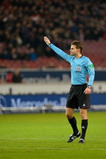 Referee Dr. Felix Brych awarding a free kick