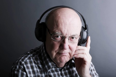 Senior wearing headphones