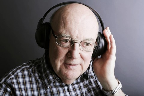 Senior wearing headphones