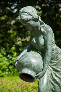 Sculpture of a woman in the garden of Blomenburg Castle
