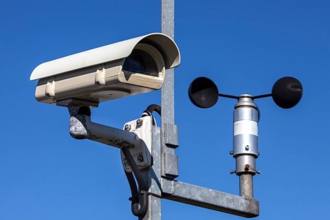 Surveillance camera and an anemometer to measure the wind speed