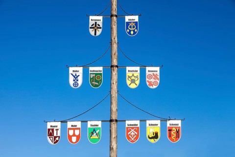 Guild pole with the emblems of all the trades of the town