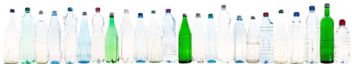 Different varieties of mineral water in bottles made of glass and plastic or PET