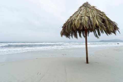 Parsol in bad weather on the Simius beach