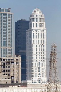 Skyscrapers and a discontinued construction site with the building shell