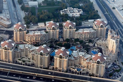 View from Burj Khalifa over a residential complex with luxury apartments and pool areas