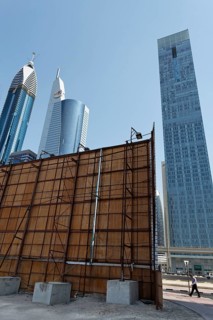 Construction site with a wooden partition in front of the skyline