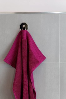 Berry-colored towel hanging on a hook